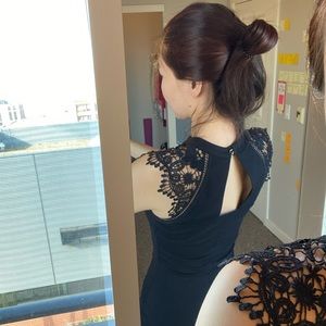 Form-fitting little black dress with lace details